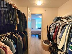 Walk-through closet for Primary Bedroom - 