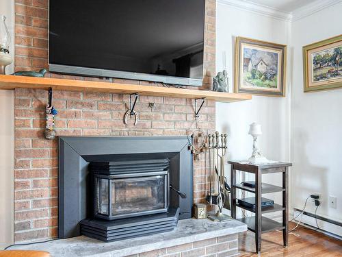 Family room - 1150 Rue Du Perche, Boucherville, QC - Indoor With Fireplace