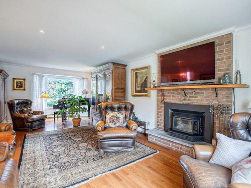 Family room - 1150 Rue Du Perche, Boucherville, QC - Indoor Photo Showing Living Room With Fireplace