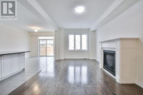 40 Sasco Way, Essa, ON - Indoor Photo Showing Other Room With Fireplace