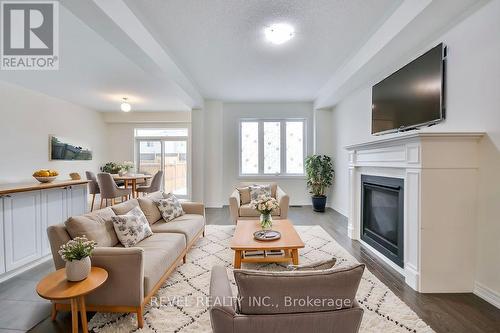 40 Sasco Way, Essa, ON - Indoor Photo Showing Living Room With Fireplace