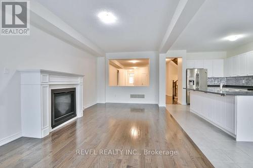 40 Sasco Way, Essa, ON - Indoor Photo Showing Kitchen With Fireplace