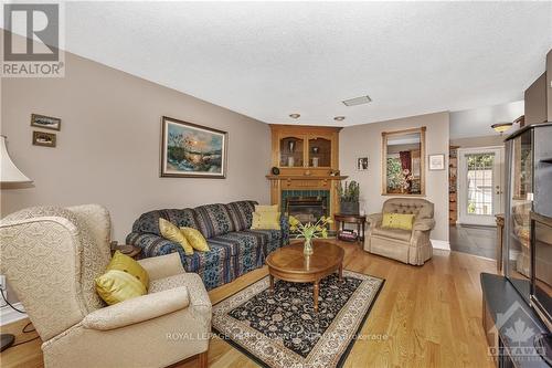 1694 Toulouse Crescent, Ottawa, ON - Indoor Photo Showing Living Room With Fireplace