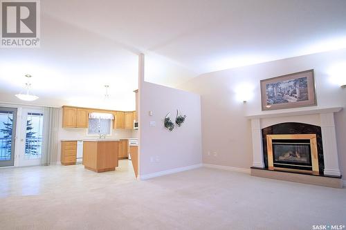 64 Ross Drive, Yorkton, SK - Indoor Photo Showing Living Room With Fireplace