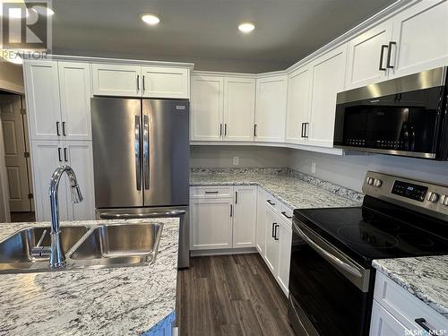 105 Hiller Drive, Air Ronge, SK - Indoor Photo Showing Kitchen With Stainless Steel Kitchen With Double Sink With Upgraded Kitchen