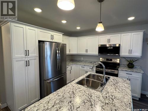 105 Hiller Drive, Air Ronge, SK - Indoor Photo Showing Kitchen With Stainless Steel Kitchen With Double Sink With Upgraded Kitchen