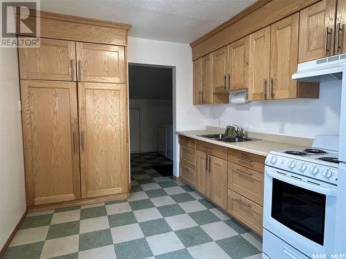 1171 106Th Street, North Battleford, SK - Indoor Photo Showing Kitchen With Double Sink