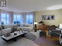 Main living area with large bay windows -staged - 11900 Olympic View Drive, Osoyoos, BC  - Indoor Photo Showing Living Room 