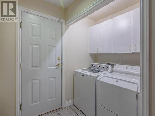 Main floor washer/dryer - 11900 Olympic View Drive, Osoyoos, BC - Indoor Photo Showing Laundry Room