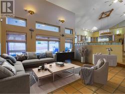 Open living & kitchen area with loads of natural light - main floor (virtually staged) - 