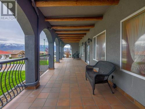 Spacious front covered patio - 11710 Olympic View Drive, Osoyoos, BC - Outdoor With Balcony With Deck Patio Veranda With Exterior