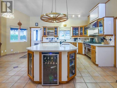 Kitchen with entrance to patio & pool - 11710 Olympic View Drive, Osoyoos, BC - Indoor Photo Showing Kitchen