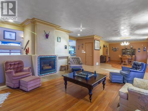 Living/dining - 11710 Olympic View Drive, Osoyoos, BC - Indoor Photo Showing Living Room With Fireplace