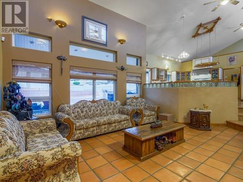 Large windows, tall ceilings - 11710 Olympic View Drive, Osoyoos, BC - Indoor Photo Showing Living Room