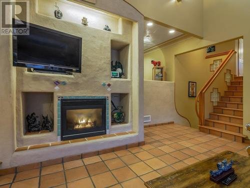 Large built-in entertainment unit with gas fireplace - 11710 Olympic View Drive, Osoyoos, BC - Indoor With Fireplace