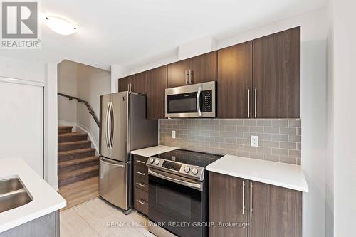 B - 713 Amberwing Private, Ottawa, ON - Indoor Photo Showing Kitchen With Double Sink