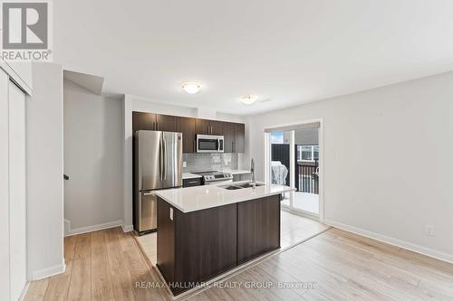 B - 713 Amberwing Private, Ottawa, ON - Indoor Photo Showing Kitchen With Double Sink