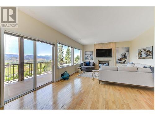 Suite Living Room - 1044 James Hockey Place, Kelowna, BC - Indoor Photo Showing Living Room With Fireplace