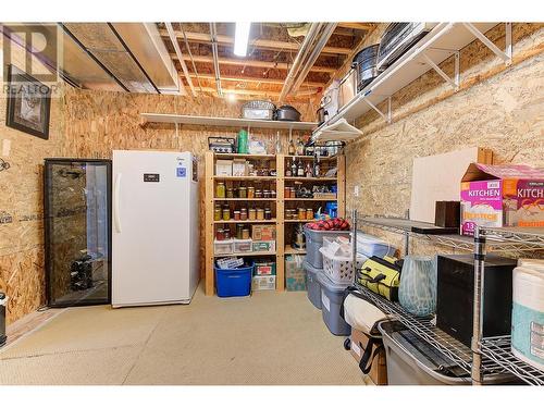 Main Floor Storage - 1044 James Hockey Place, Kelowna, BC - Indoor Photo Showing Basement