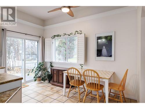 Eat in dining room off of the kitchen, and step out onto your concrete patio great for BBQing right off of the kitchen. - 615 Sutherland Avenue, Kelowna, BC - Indoor Photo Showing Dining Room