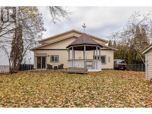 Back of the home, with large concrete patio off of the kitchen great for entertaining and bbqs - 615 Sutherland Avenue, Kelowna, BC - Outdoor With Deck Patio Veranda