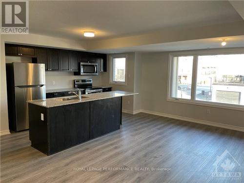 704 Kizis, Ottawa, ON - Indoor Photo Showing Kitchen With Stainless Steel Kitchen With Double Sink