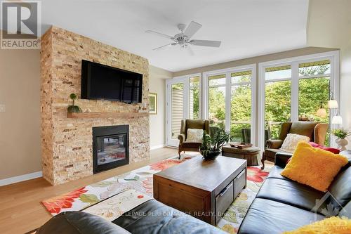 43 Aveia, Ottawa, ON - Indoor Photo Showing Living Room With Fireplace