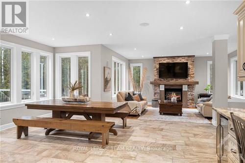 8044 Adam Baker Way, Ottawa, ON - Indoor Photo Showing Living Room With Fireplace