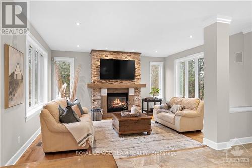 8044 Adam Baker Way, Ottawa, ON - Indoor Photo Showing Living Room With Fireplace