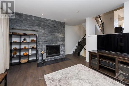 52 Reaney Court, Ottawa, ON - Indoor Photo Showing Living Room With Fireplace