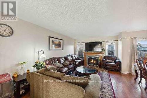 115 Destiny, Ottawa, ON - Indoor Photo Showing Living Room With Fireplace