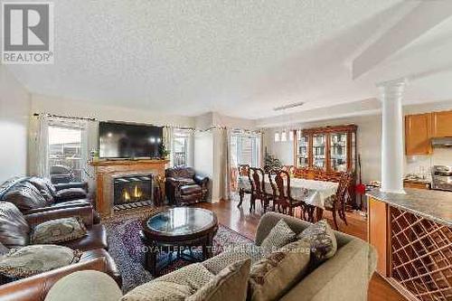 115 Destiny, Ottawa, ON - Indoor Photo Showing Living Room With Fireplace