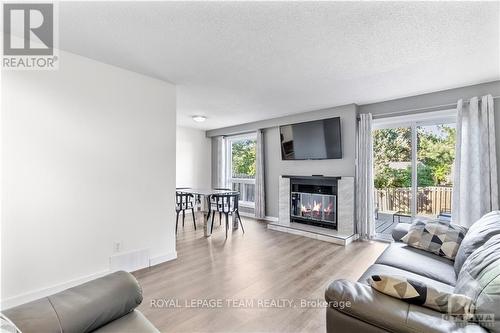 34 Shadetree Crescent, Ottawa, ON - Indoor Photo Showing Living Room With Fireplace