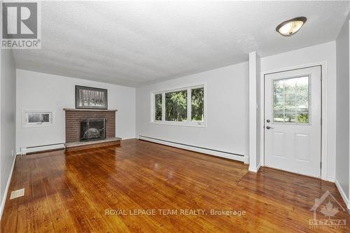 697 Oak Creek Road, Ottawa, ON - Indoor Photo Showing Living Room With Fireplace