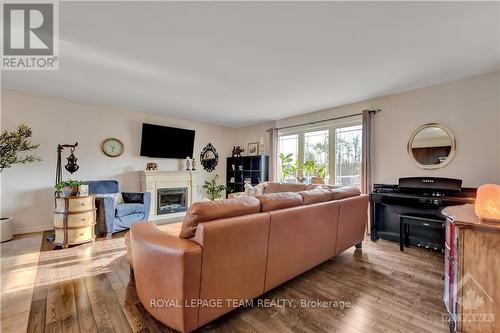 424 Hyndman Road, Edwardsburgh/Cardinal, ON - Indoor Photo Showing Living Room With Fireplace