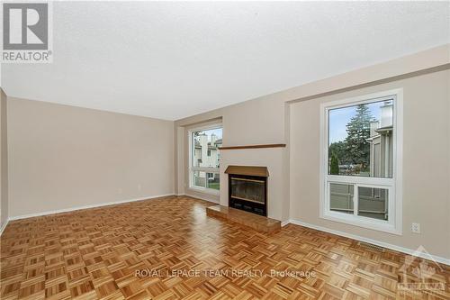 C - 9 Castlebrook Lane, Ottawa, ON - Indoor Photo Showing Living Room With Fireplace