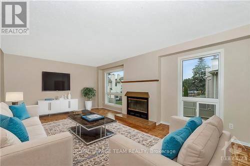 C - 9 Castlebrook Lane, Ottawa, ON - Indoor Photo Showing Living Room With Fireplace