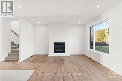 305 Wood Avenue, Smiths Falls, ON - Indoor Photo Showing Living Room With Fireplace