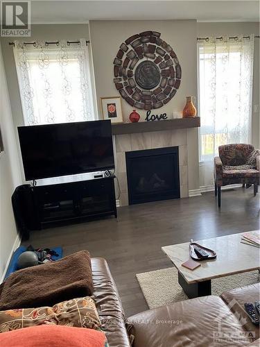 82 Warrior Street, Ottawa, ON - Indoor Photo Showing Living Room With Fireplace