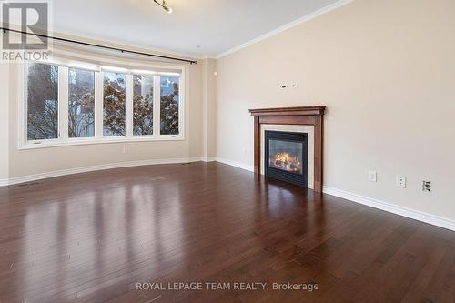 421 Meadowhawk Crescent, Ottawa, ON - Indoor Photo Showing Living Room With Fireplace