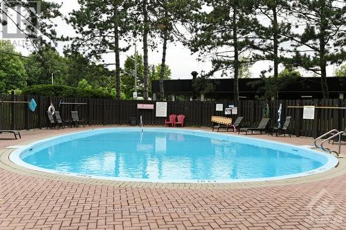 102 - 2951 Riverside Drive, Ottawa, ON - Outdoor With In Ground Pool With Backyard