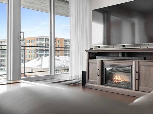 Living room - 308-1425 Rue Isabelle-Aubert, Québec (Les Rivières), QC - Indoor Photo Showing Living Room With Fireplace