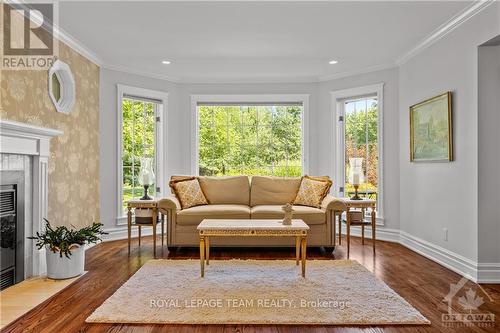 136 Kerscott Heights Way, Ottawa, ON - Indoor Photo Showing Living Room With Fireplace