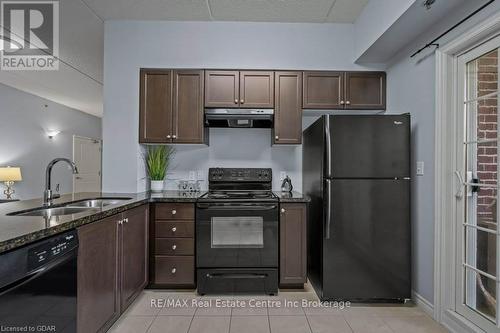 113 - 1440 Gordon Street, Guelph (Pine Ridge), ON - Indoor Photo Showing Kitchen With Double Sink