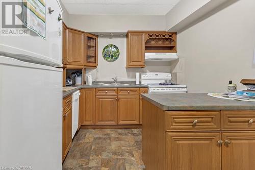 Kitchen featuring white appliances and sink - 163 Ferguson Drive Unit# 302, Woodstock, ON - Indoor Photo Showing Kitchen