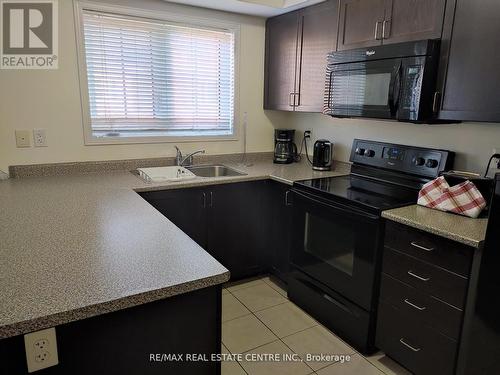 09 - 47 Hays Boulevard, Oakville, ON - Indoor Photo Showing Kitchen With Double Sink