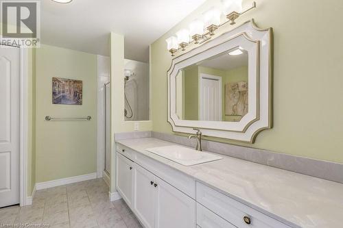 Bathroom with vanity and a shower with shower door - 77 Governors Road Unit# 501, Dundas, ON - Indoor Photo Showing Bathroom