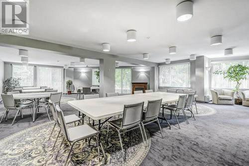 Dining area with carpet flooring - 77 Governors Road Unit# 501, Dundas, ON - Indoor Photo Showing Dining Room