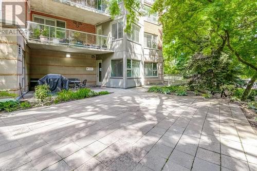 Back of property featuring a balcony and a patio area - 77 Governors Road Unit# 501, Dundas, ON - Outdoor With Balcony