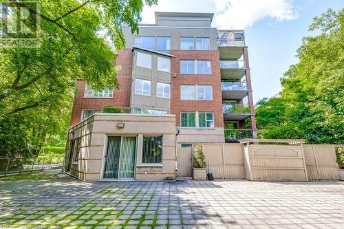 View of rear view of property - 77 Governors Road Unit# 501, Dundas, ON - Outdoor With Facade